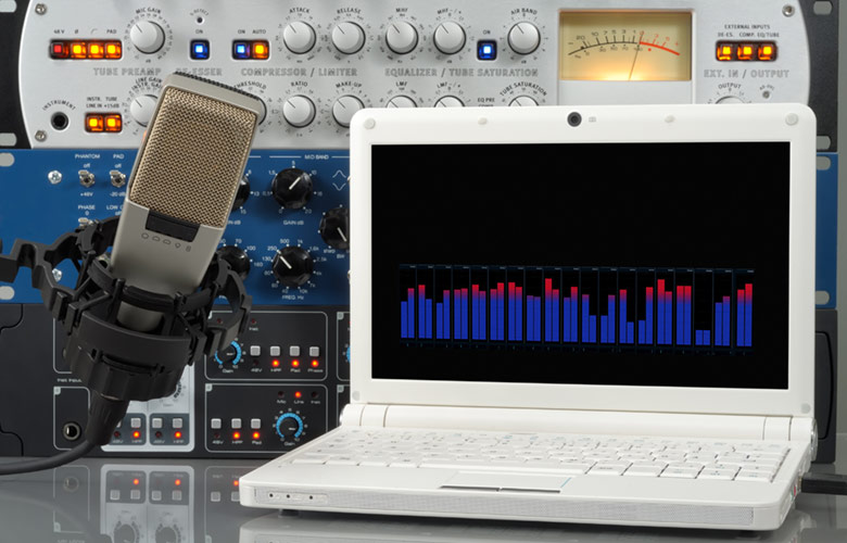 Audio setup containing microphone, laptop and other professional sound design devices